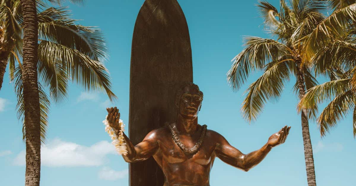 man-statue-under-blue-sky