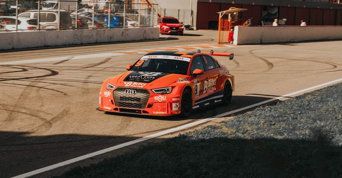 an-orang-audi-rs-3-racecar-at-a-racetrack-2