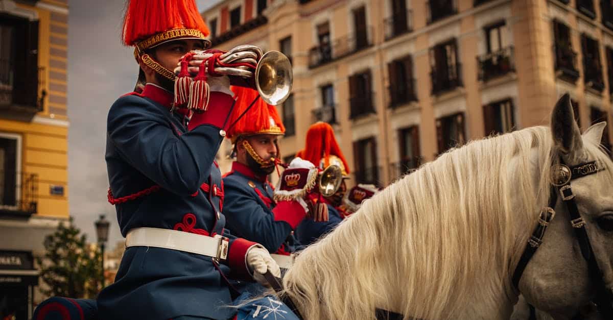 two-men-in-red-uniforms-playing-trumpets-on-horses